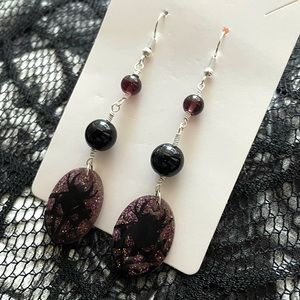purple spider web earrings